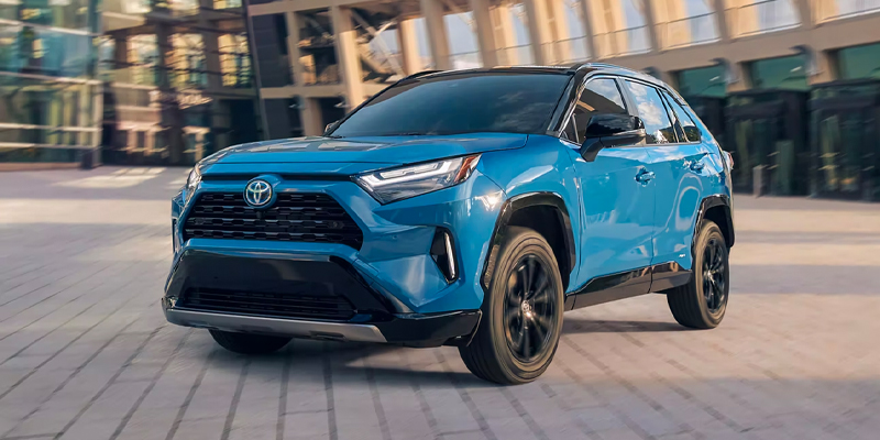 Side profile of the used 2024 Toyota RAV4 Hybrid, highlighting its aerodynamic shape and stylish wheels in San Antonio, TX.